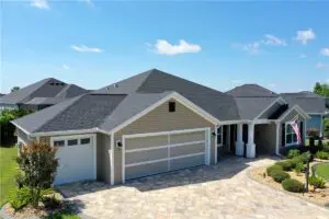 beige house with newly built asphalt shingle roof