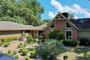 brick house with new asphalt shingle roof