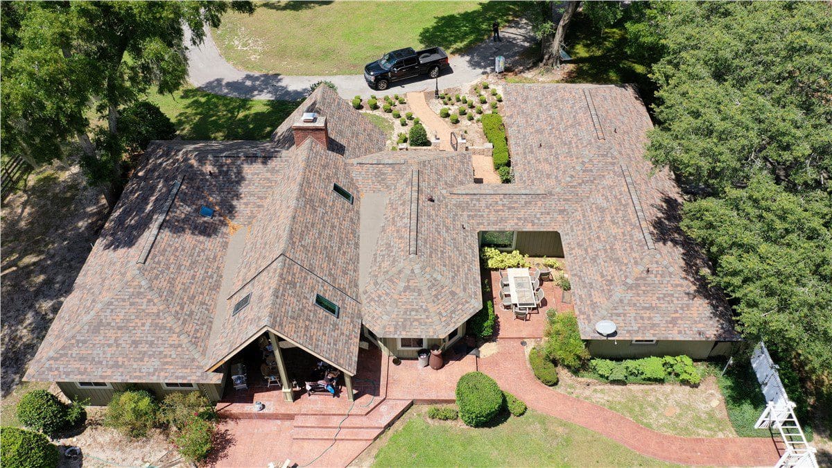 birdseye view of newly built multicolored asphalt shingle roof