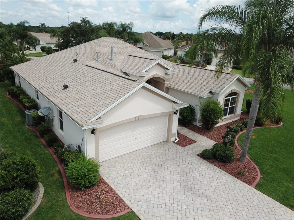 white house with light gray asphalt shingle roof