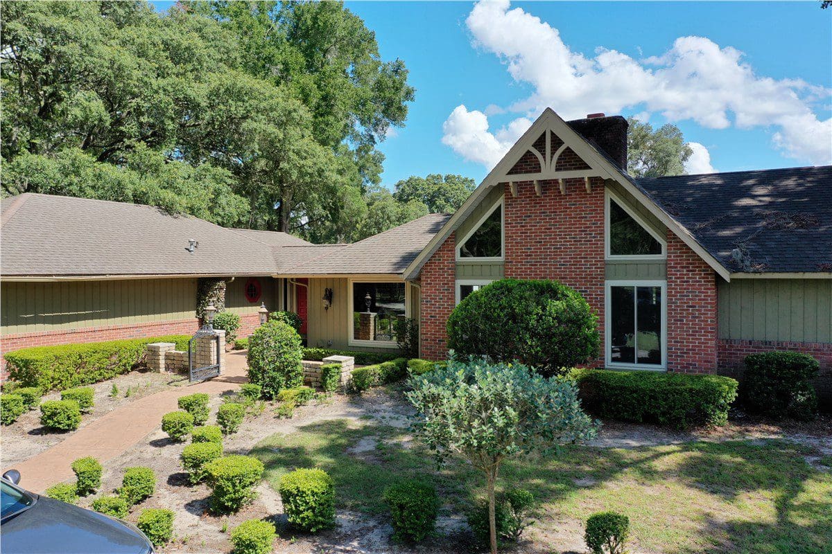 brick house with new asphalt shingle roof