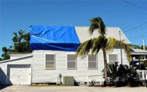 blue tarp over damaged roof