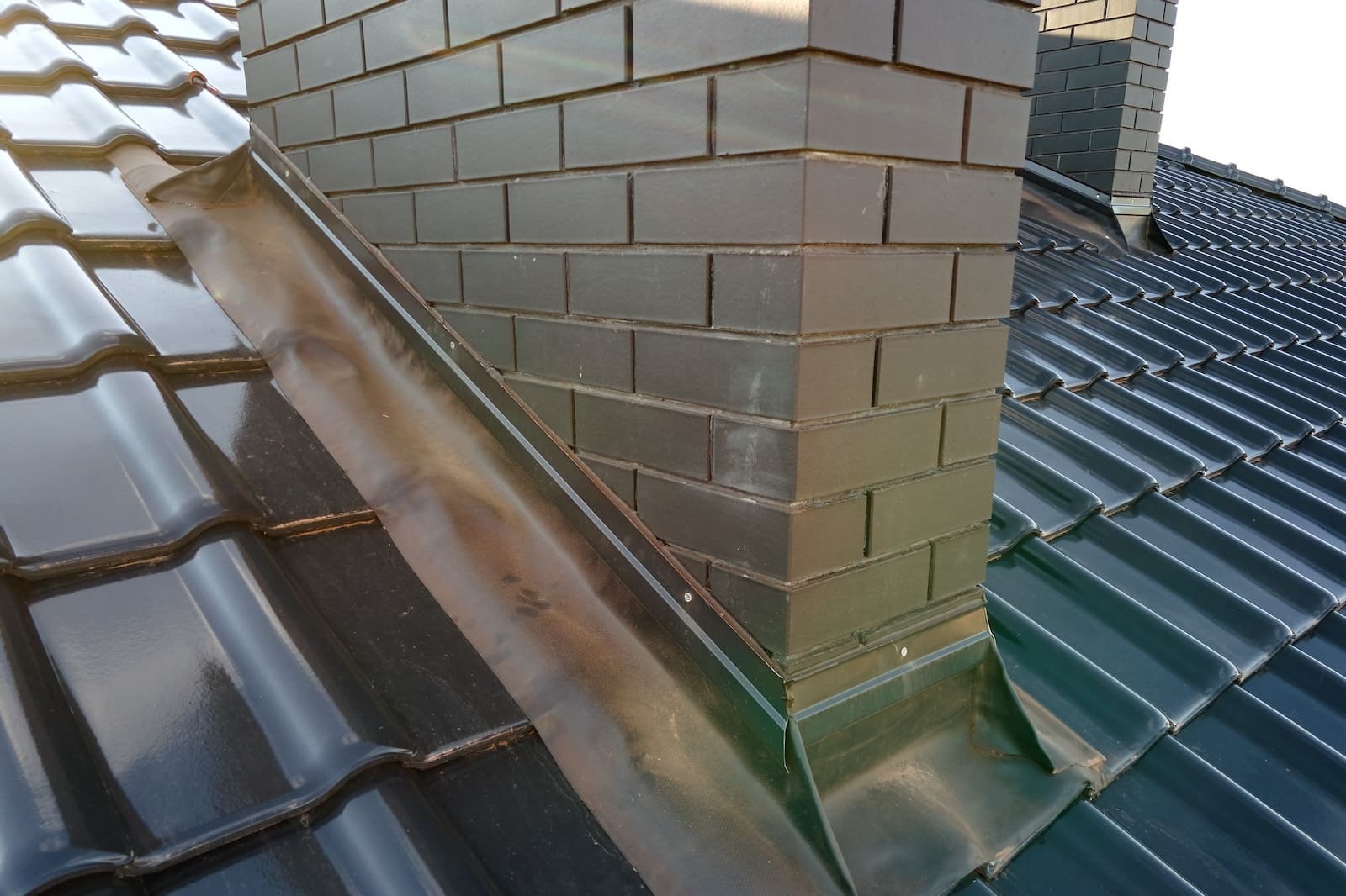 Close up of roof flashing around roof chimney in central florida