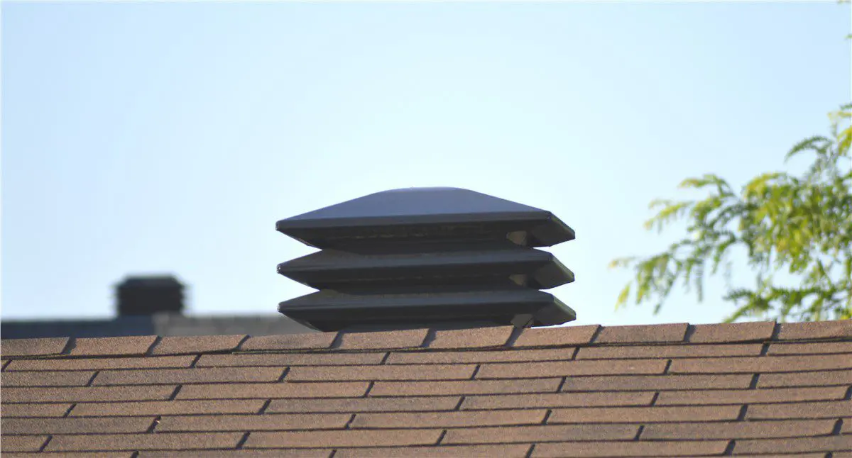 attic vent on to of an asphalt shingle roof