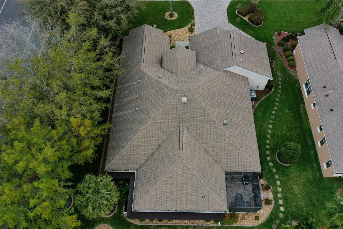 aerial view of brown asphalt shingle home