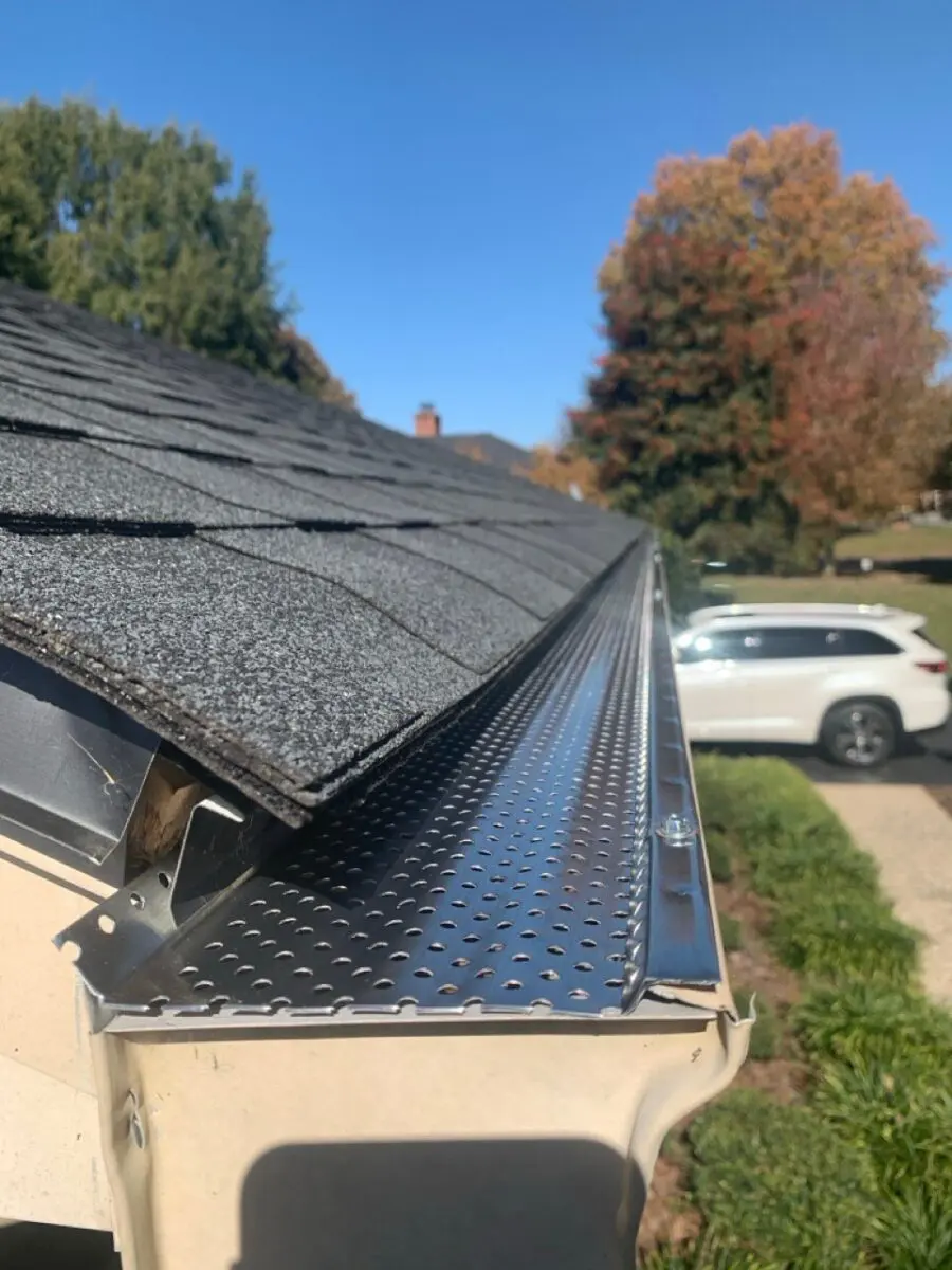 gutter guard on asphalt shingle roof