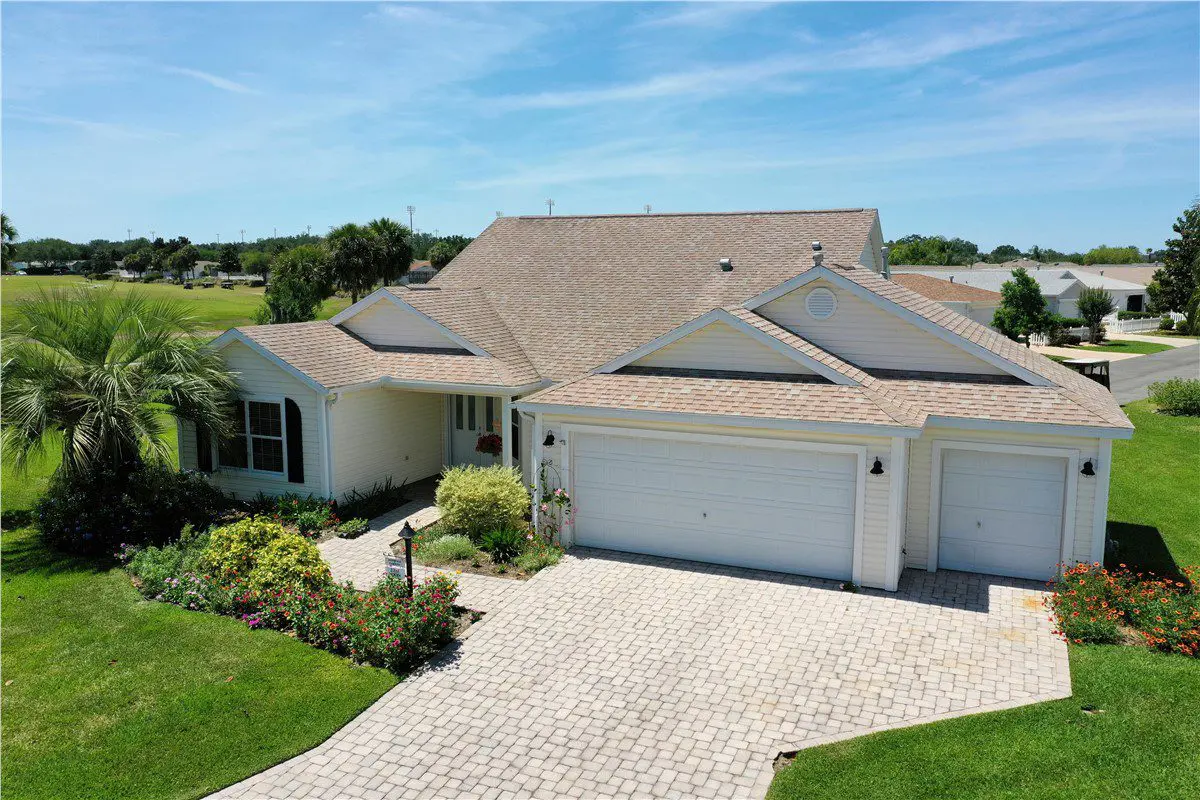 home with tan asphalt shingle roof